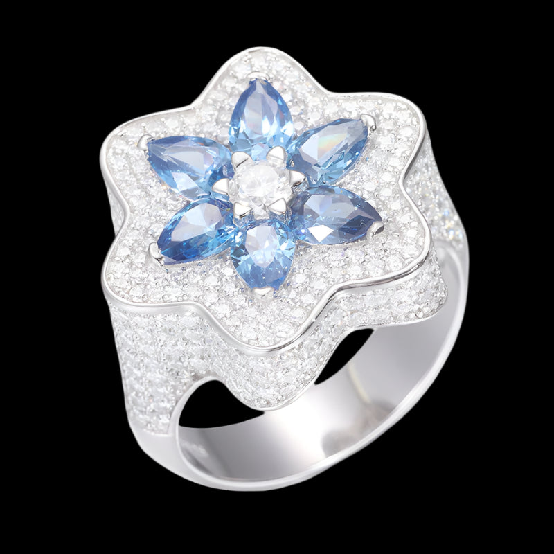 Star-shaped ring in sterling silver, featuring blue moissanite and white diamonds.