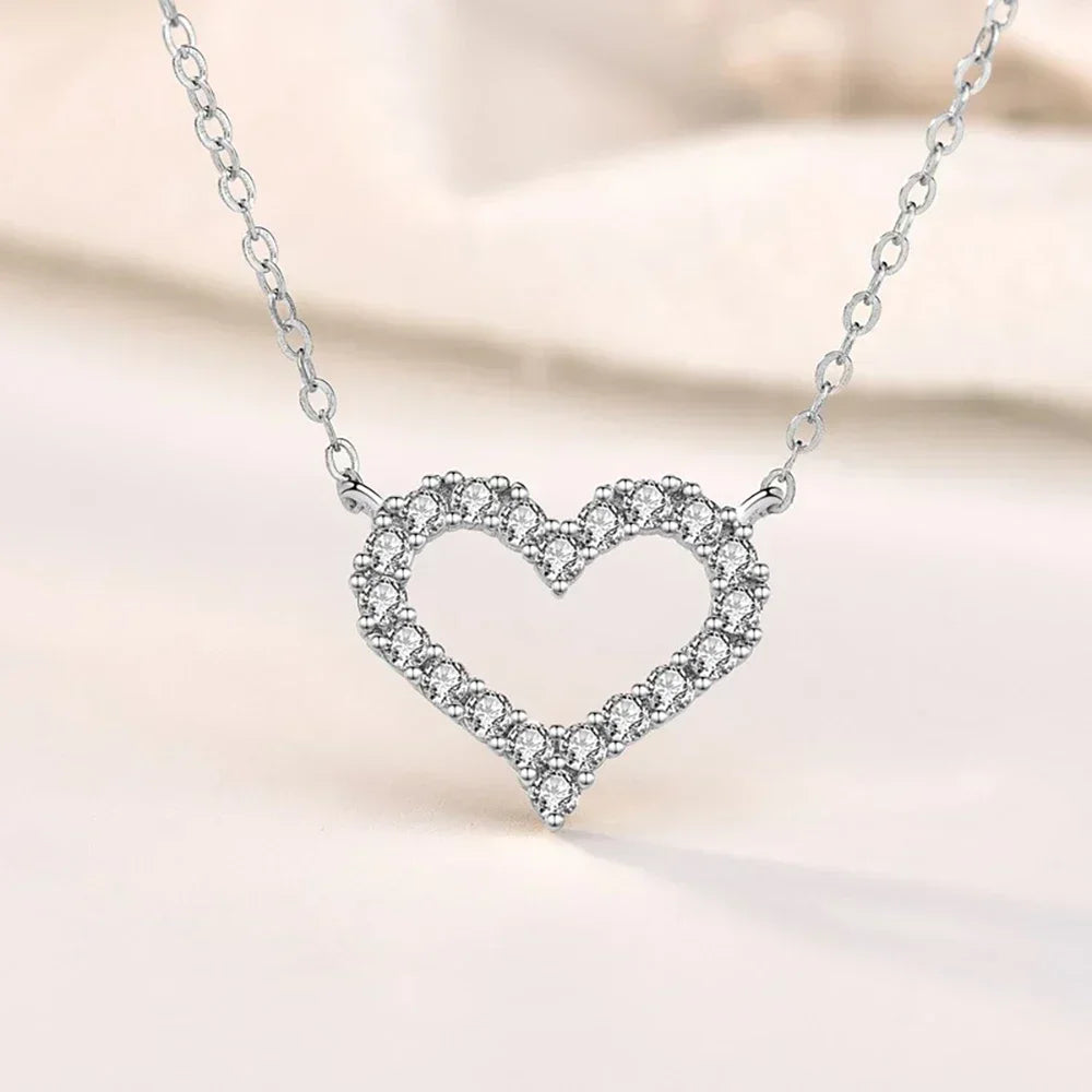 Romantic silver heart pendant, moissanite fire.