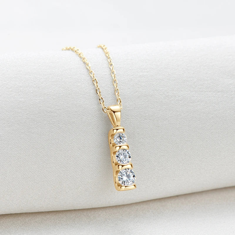 Elegant moissanite pendant and earring set in polished sterling silver.