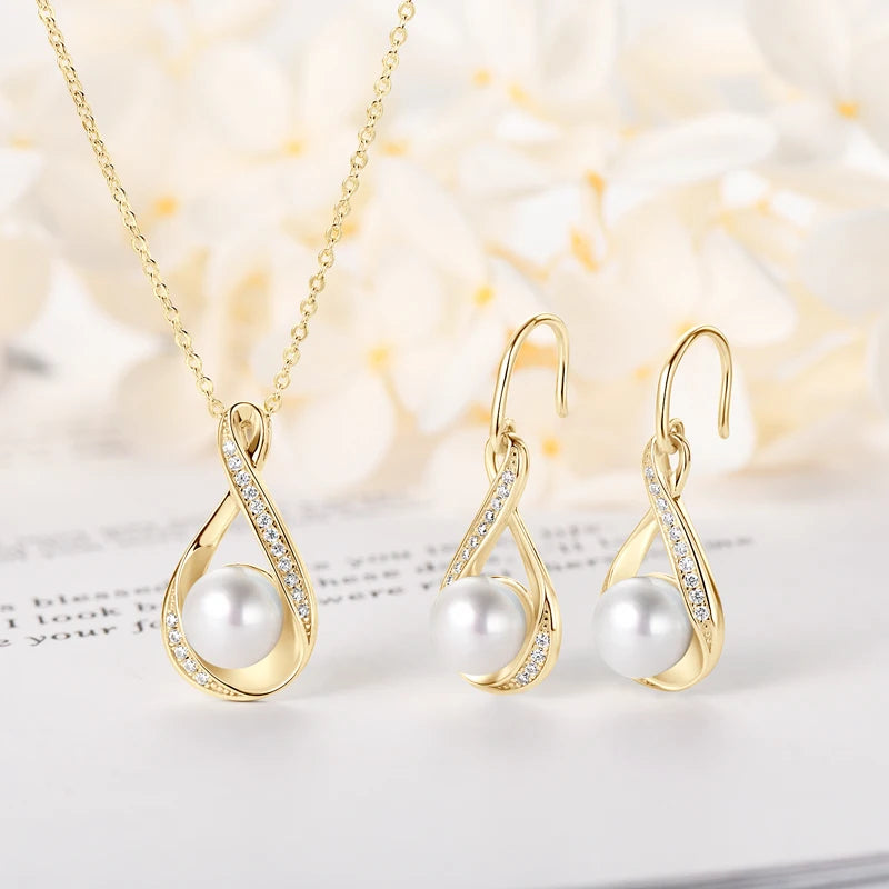 Moissanite & pearl set in sterling silver: delicate necklace and matching earrings, timeless style.