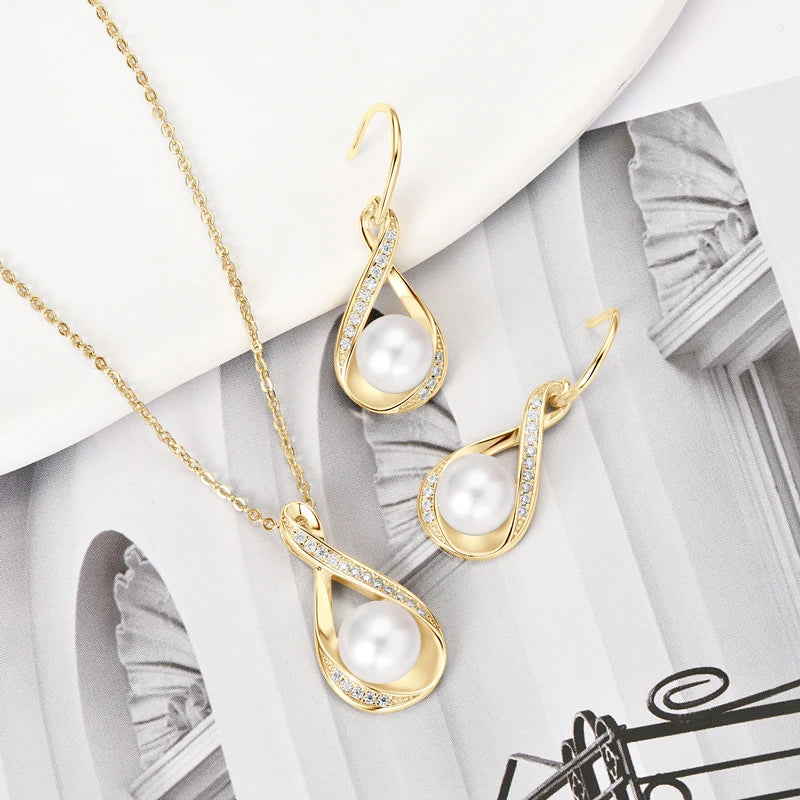 Chic sterling silver jewelry set: freshwater pearls, moissanite diamonds, elegant simplicity.