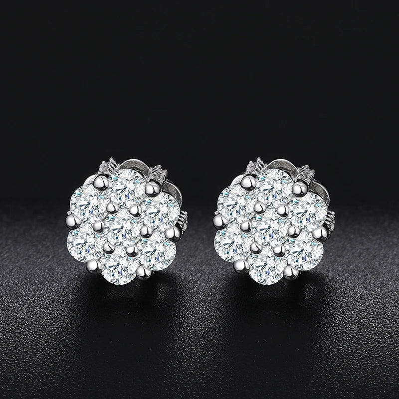 Sterling silver stud earrings with a floral design of moissanite and small diamonds.