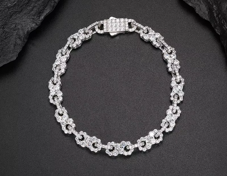 Dazzling moissanite and diamond bracelet in a classic sterling silver setting.