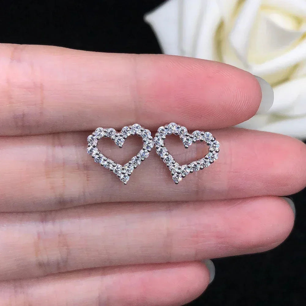 Dazzling moissanite heart earrings in silver.