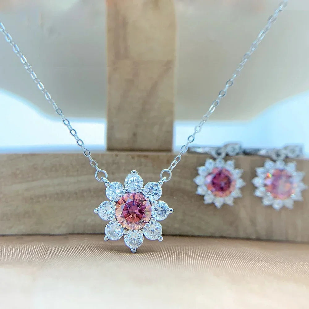 Sparkling moissanite necklace and earrings in polished sterling silver.