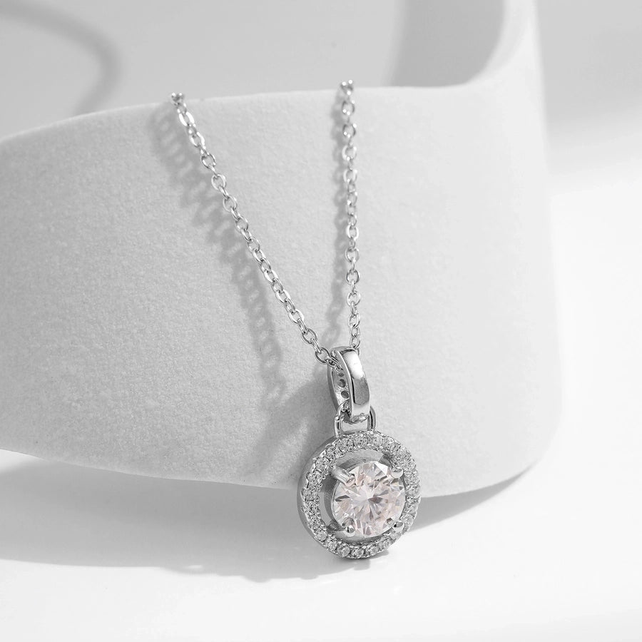 Dazzling moissanite pendant, thin silver chain, solitaire style.