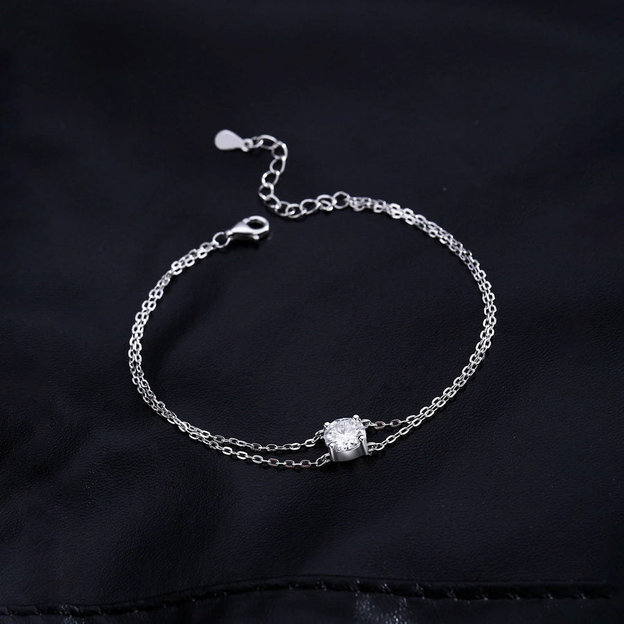 Moissanite bracelet in sterling silver. Simple, elegant design.

