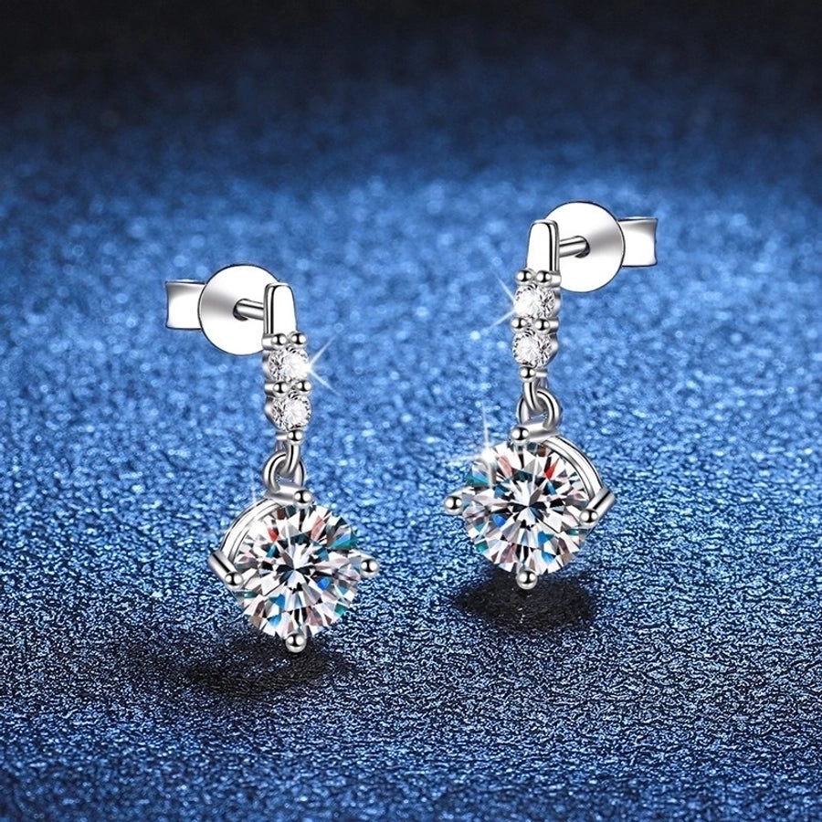 Dazzling earrings, sterling silver with moissanite & diamond accents. Chic jewelry.