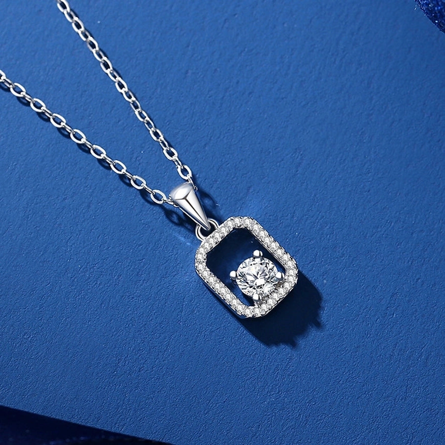 Sparkling moissanite pendant on a silver necklace.