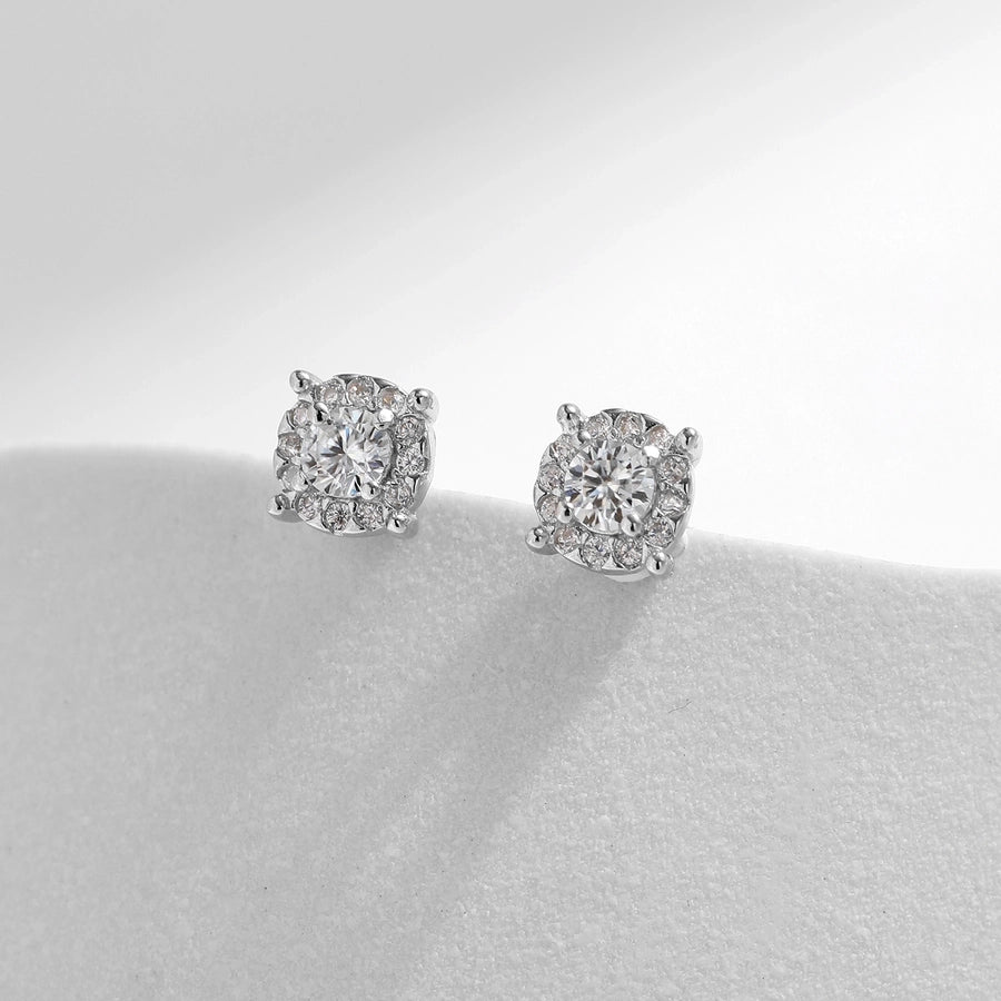 Elevate your look: Moissanite & diamond earrings in polished sterling silver.