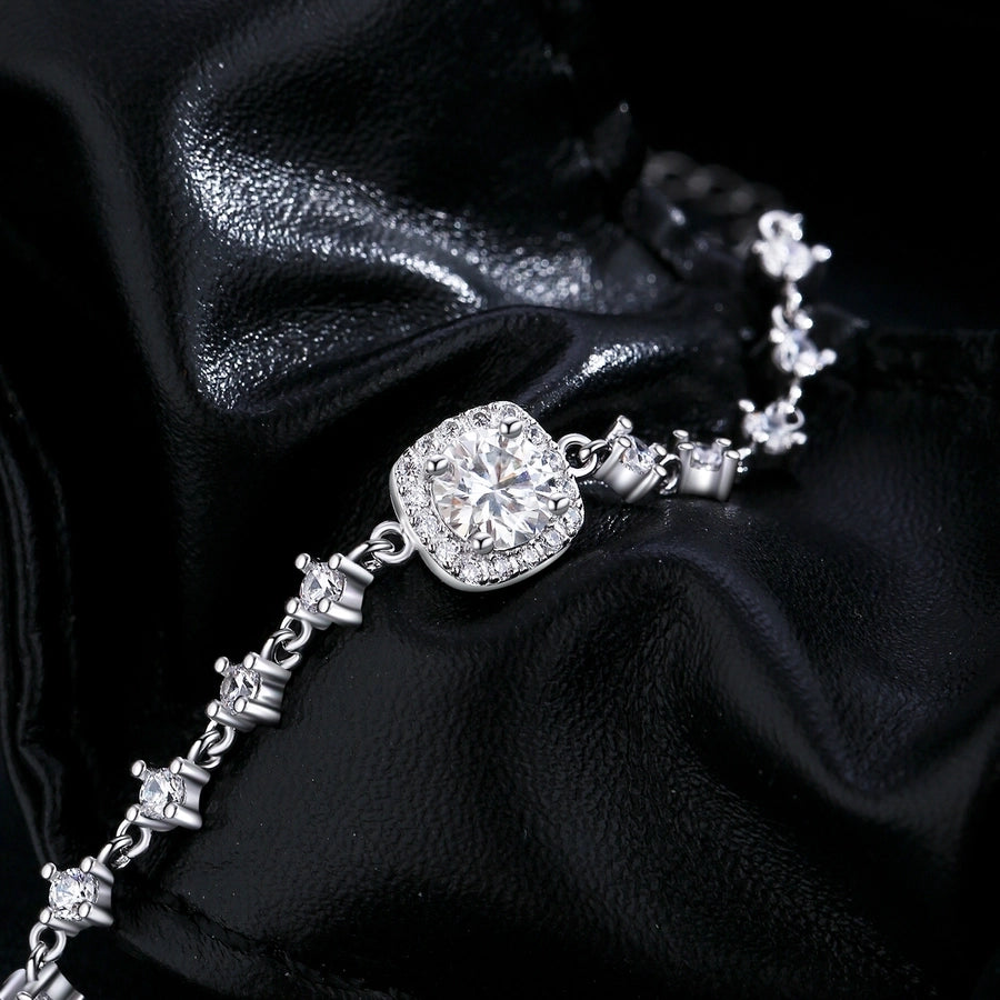 Sparkling moissanite and diamond bracelet in sterling silver, elegant design.








