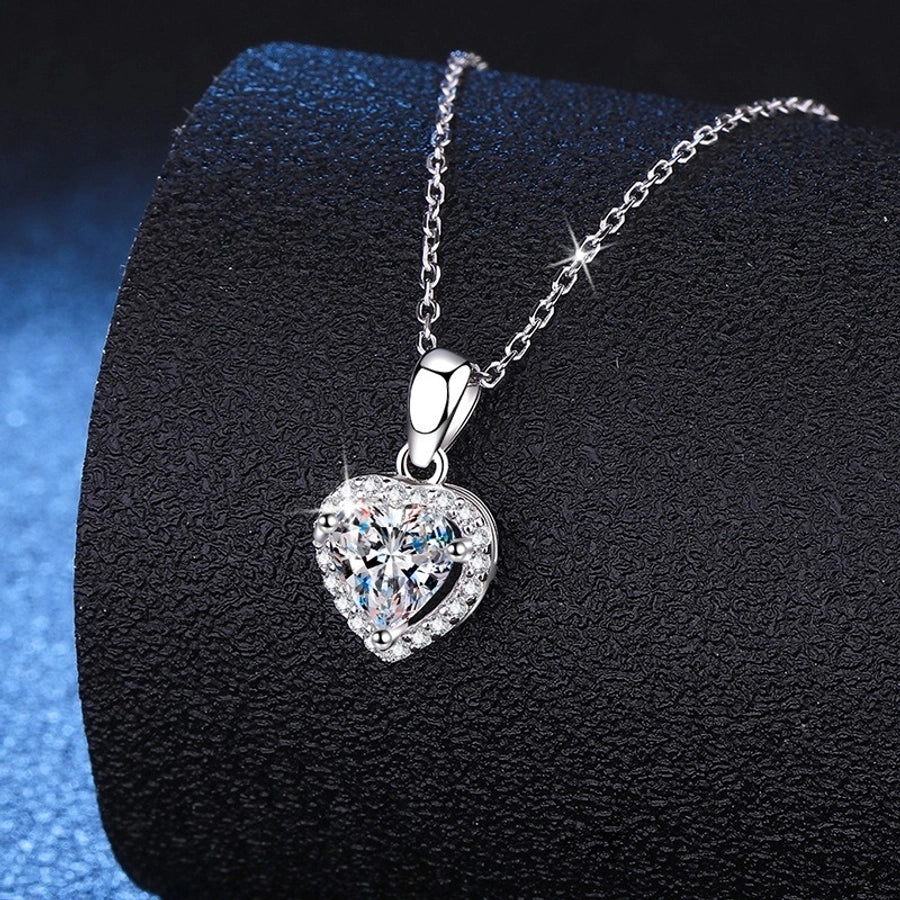 Elegant heart-shaped moissanite pendant on silver chain.