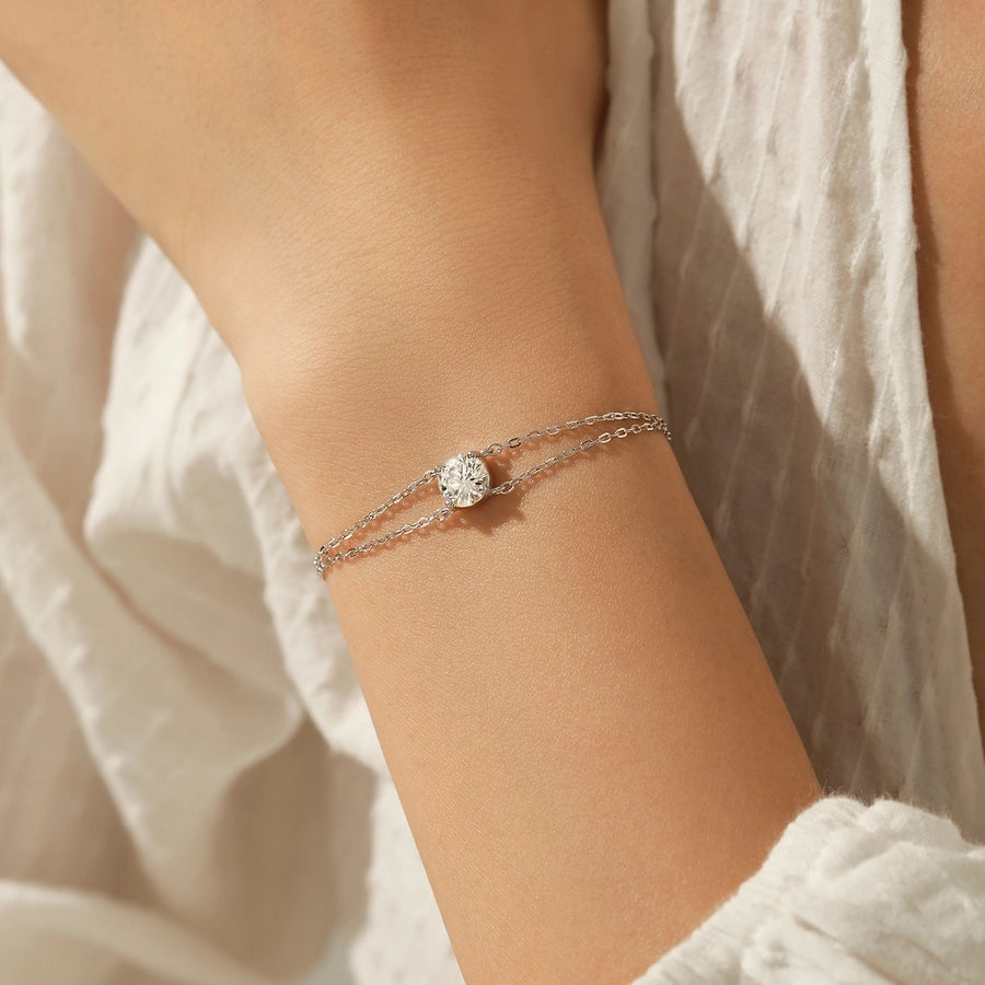 Dainty sterling silver bracelet with a bright moissanite stone.