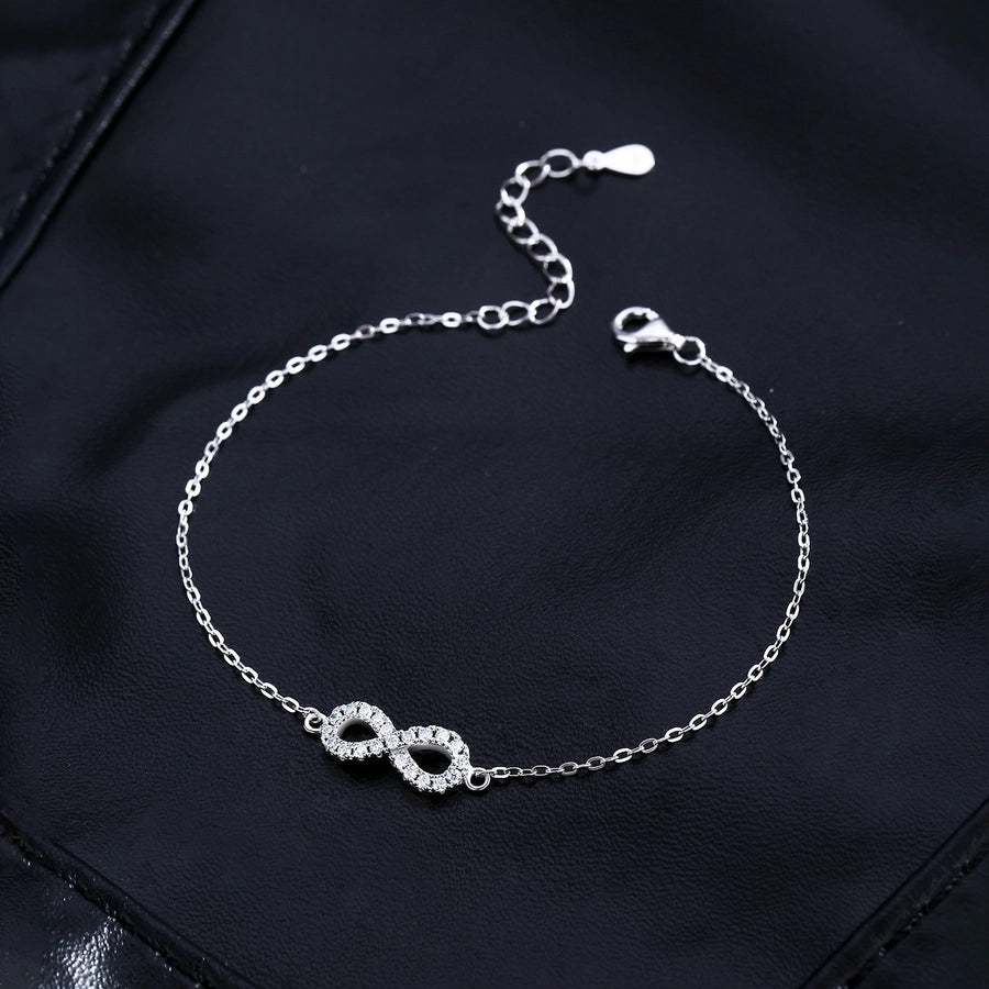 Moissanite diamond infinity bracelet, sterling silver, delicate and elegant.