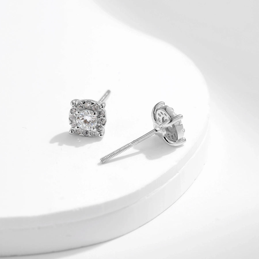 Elevate your look: Moissanite & diamond earrings in polished sterling silver.