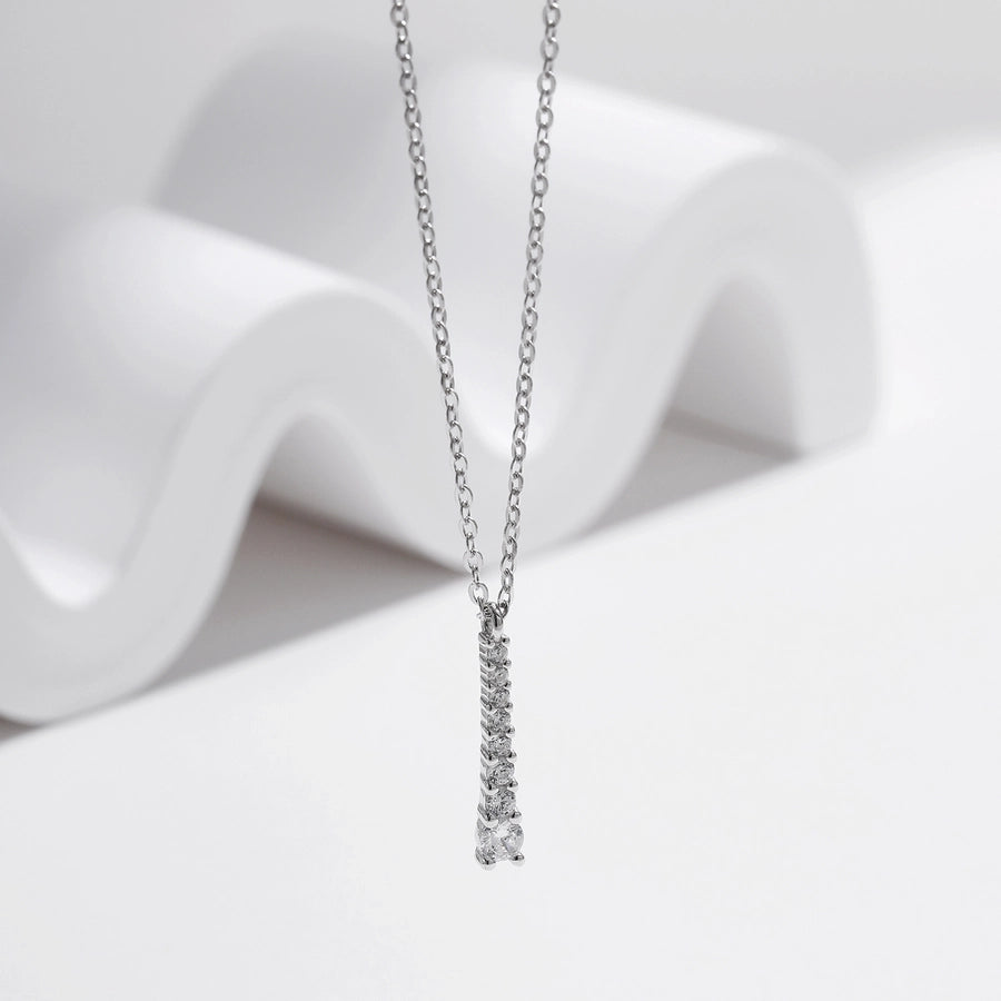 Dainty moissanite necklace, sterling silver setting. Sparkly and elegant.