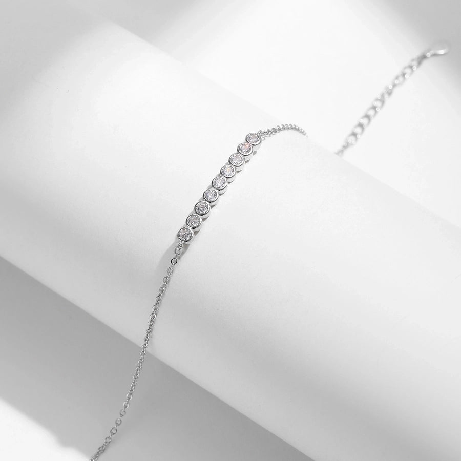 Simple yet stunning: moissanite bracelet set in polished silver.