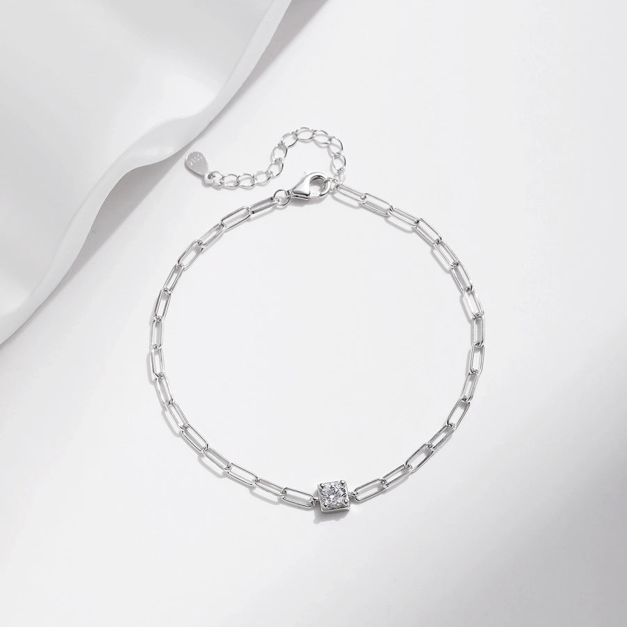 Sparkling moissanite diamond on a sleek sterling silver chain bracelet.