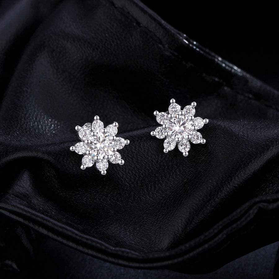 Sparkling moissanite & diamond flower earrings in sterling silver.