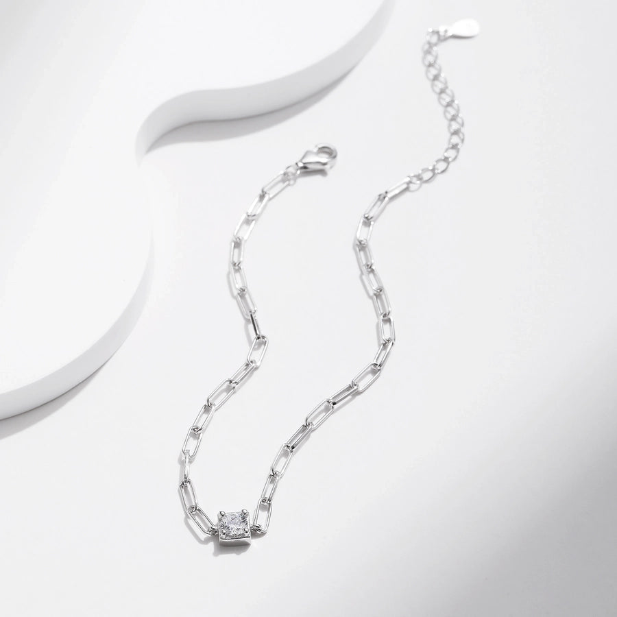 Delicate moissanite bracelet in polished sterling silver. Simple elegance.