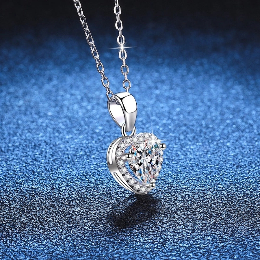 Sparkling heart moissanite necklace, sterling silver setting.