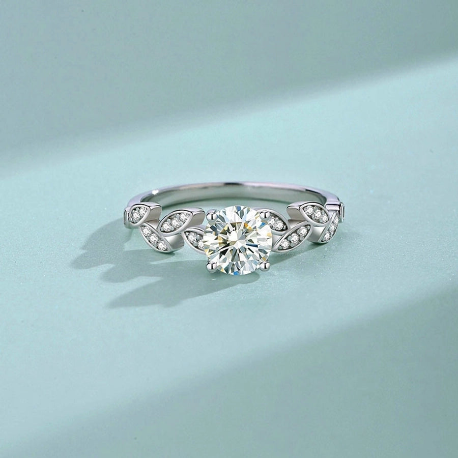 Sparkling moissanite ring in 925 sterling silver with delicate leaf details.